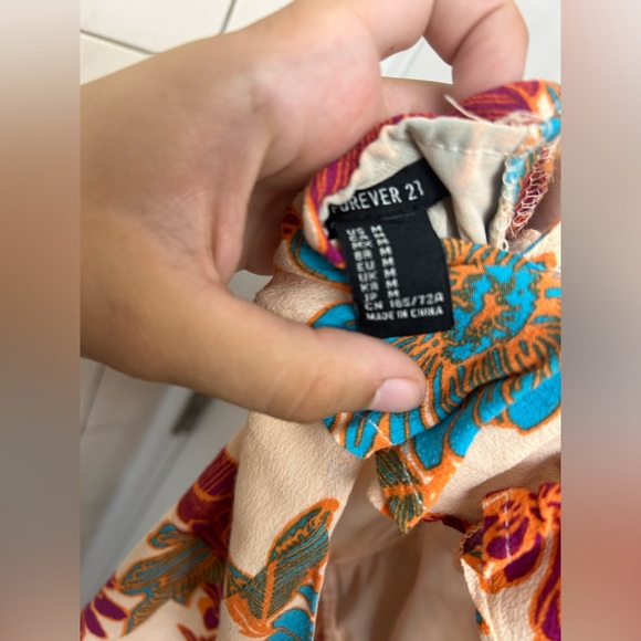 Tan floral romper from Forever 21 Woman’s Size Medium - Picture 2 of 3